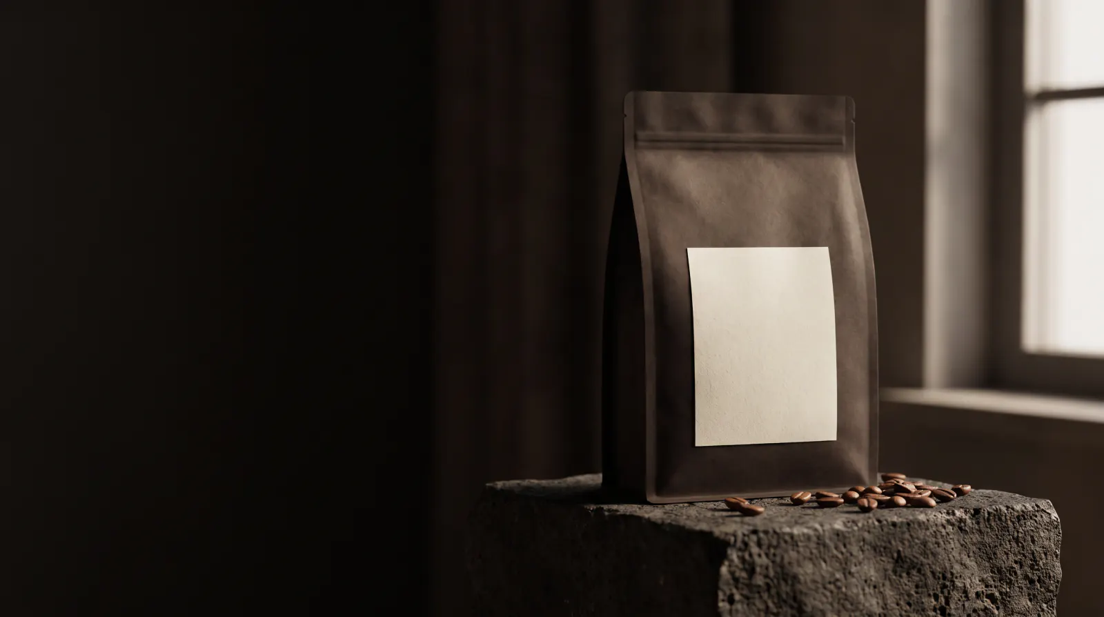 A matte espresso-brown Kawa Kawa bag of Huye on a rough stone plinth in low window light